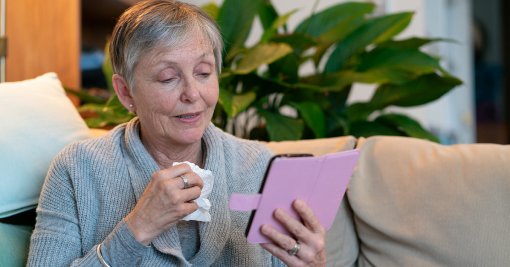Older woman taking a Telehealth call on her phone